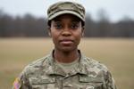 Woman in uniform looking at camera