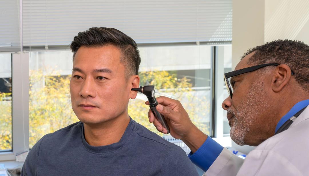Man having his ear checked