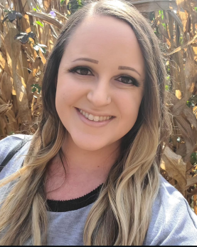 Shelby Cooper in a corn field