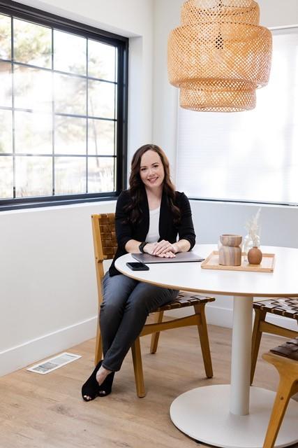Megan Knea sitting at a table