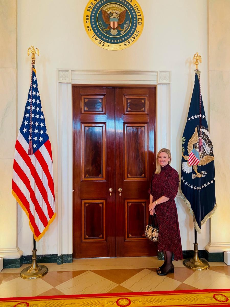 CC Gallagher standing in front of a door