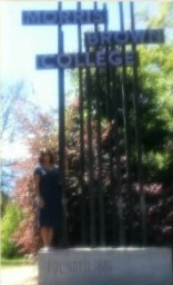 Woman stands in front of sign that says "Morris Brown College"