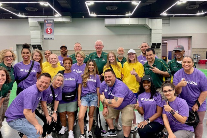 Group of people in purple shirts